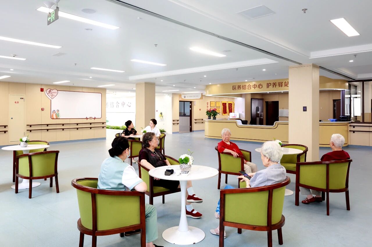 Older residents and care staff in the community area of the integrated health and elderly care center
