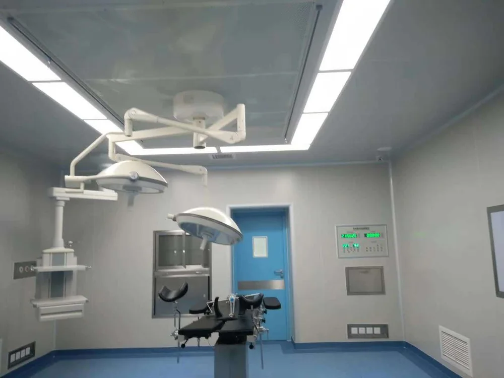 Surgical lighting and equipment installed around the operating table.